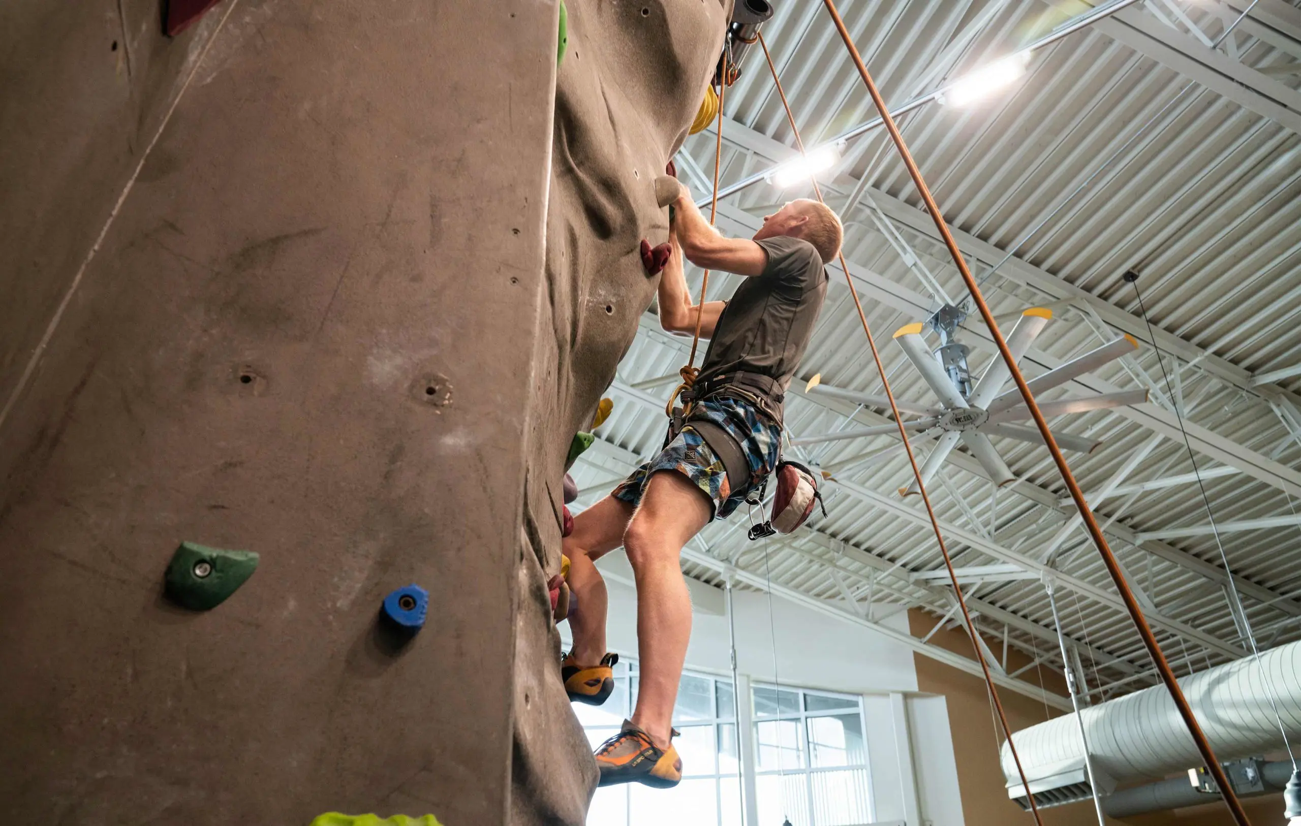 New-Thought-Visit-Pinedale-Wyoming-Ad-Photography-Man-Indoor-Rock-Climbing-At-Pinedale-Aquatic-Center-fullscreen