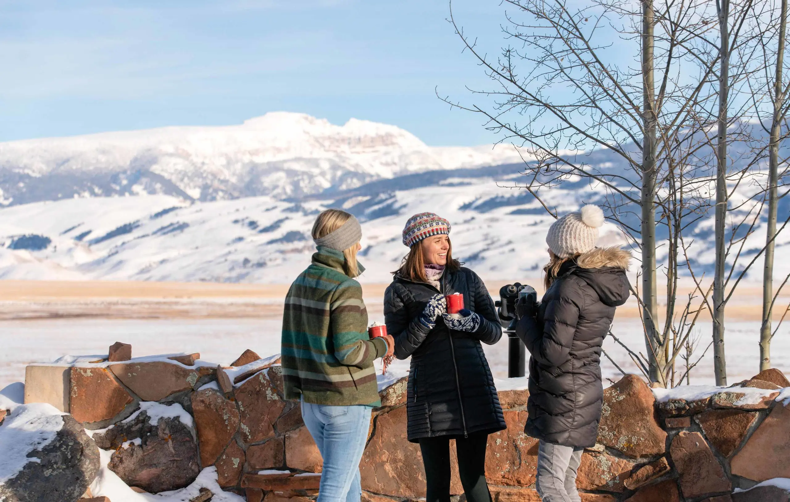 New-Thought-National-Museum-of-Wildlife-Art-Ad-Photography-Three-Women-Have-Drinks-On-Deck-Winter-fullscreen